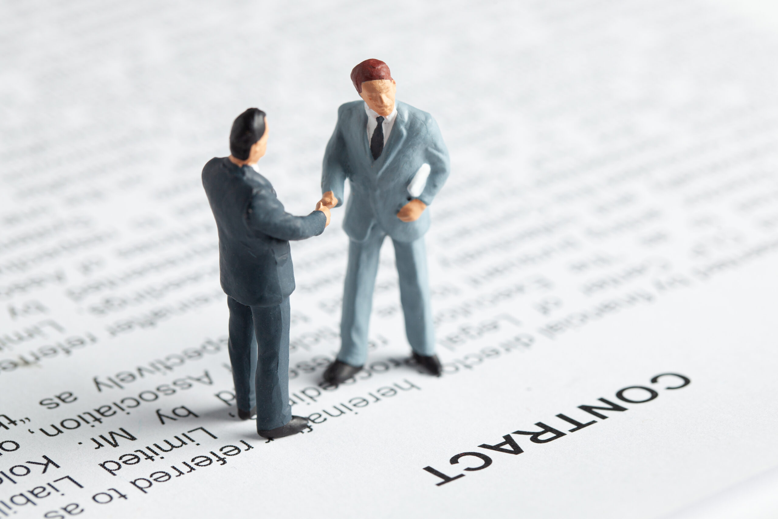 Businessmen shake hands as a sign of the successful signing of t