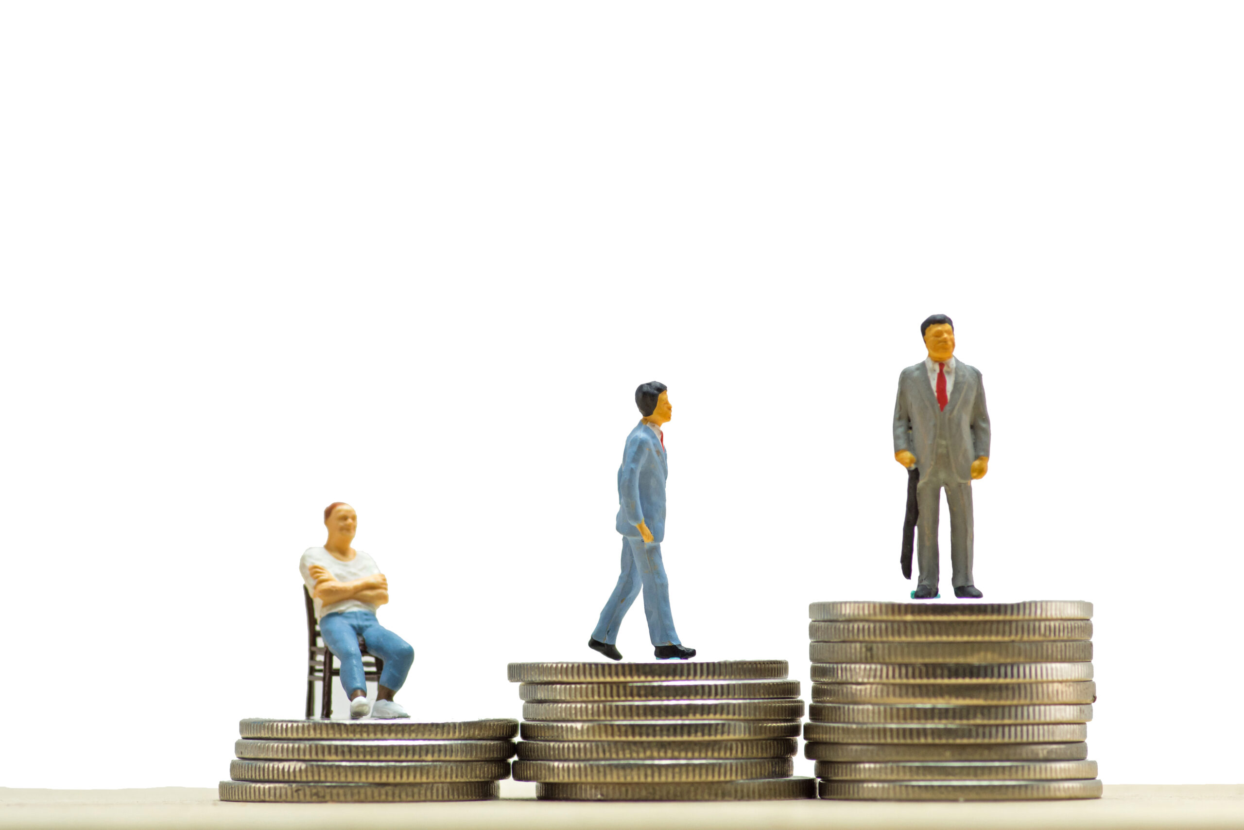 Miniature business people on step of coin money
